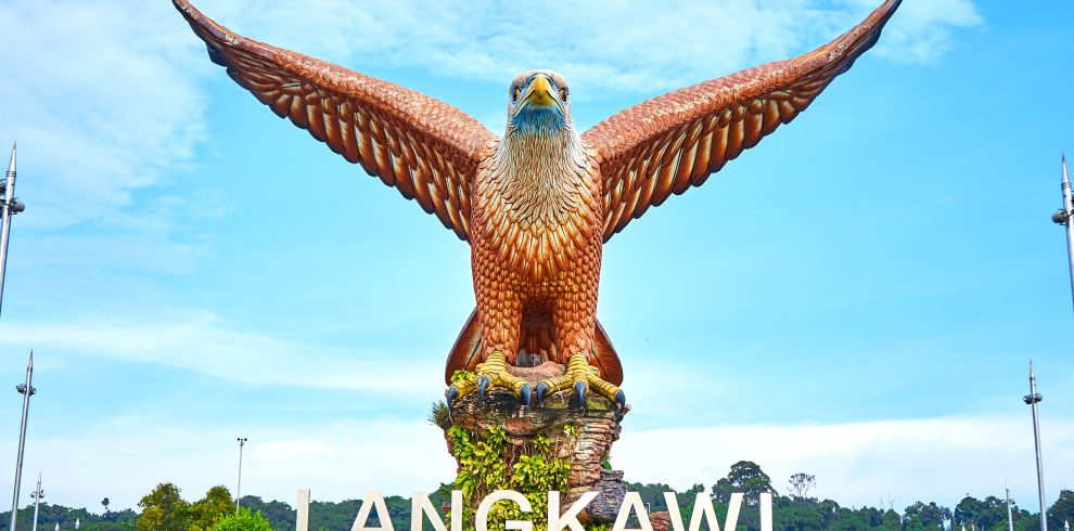 A sculpture of a red eagle spreading its wings. Popular tourist spot on Langkawi island